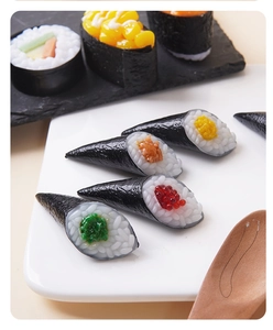 Macro shot of realistic miniature sushi toys featuring seaweed texture and vibrant toppings