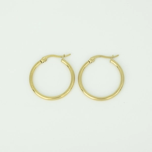Macro detail of classic gold stainless steel hoop earrings with secure latch back closure