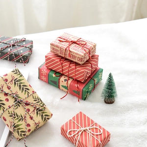 Three-piece Christmas gift box set with festive patterns on a white plush background