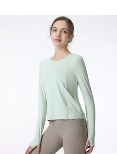 Detail of thumbhole cuffs and moisture-wicking fabric on long-sleeve yoga top