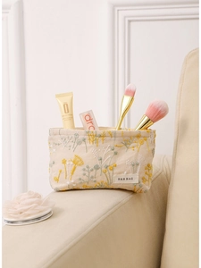Trousse à maquillage beige en lin avec broderie florale jaune et rangement pinceaux