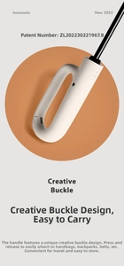 Detail of creative ring-buckle handle on automatic cream umbrella for easy bag attachment