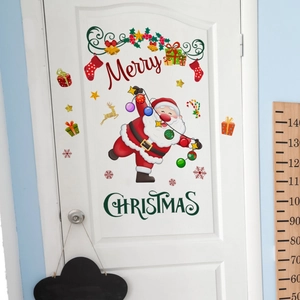 Detail of Santa Claus wreath wall sticker with Merry Christmas text on a white door