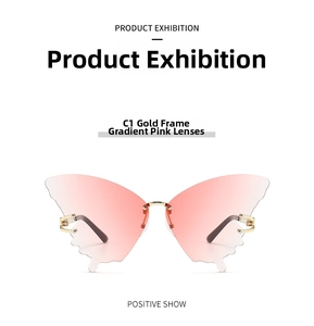 Detail view of butterfly rimless sunglasses with gold frame and gradient pink lenses