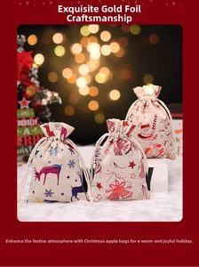 Detailed view of Christmas drawstring linen bags with gold foil elk and snowflake patterns