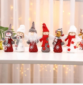 Detailed view of six assorted plush Christmas ornaments with knits and faux fur textures