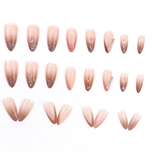 Gradient pink press-on nails with silver glitter and rhinestone accents in 24 piece set
