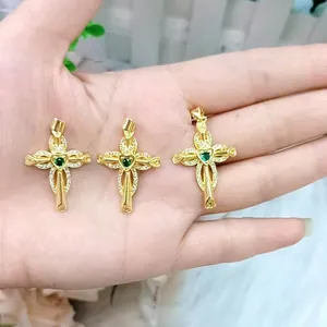 18K gold cross pendants set with heart emerald center and white diamond accents