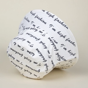 Detail of white bucket hat showing high fashion print and durable stitching finish