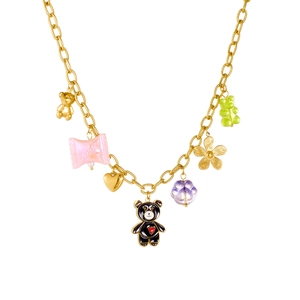 Gold chain necklace with colorful gummy bear, heart, and flower charms on white background