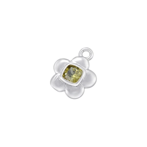 Macro shot of silver flower pendant with yellow square gemstone and polished details