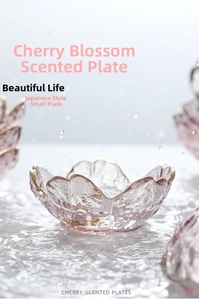 Macro shot of cherry blossom glass dish with gold rim and hammered texture