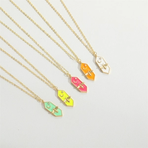 Colorful insect pendant necklaces with golden bees and crescents on thin gold chains
