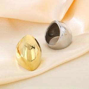 Minimalist wide geometric stainless steel rings in gold and silver on silk background