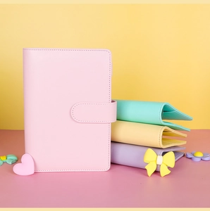 Detailed view of A6 PU leather budget binders in pink, mint, yellow and purple colors