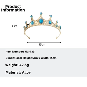 Detail of gold tiara with blue crystals showing dimensions 5x15cm and 42.5g weight