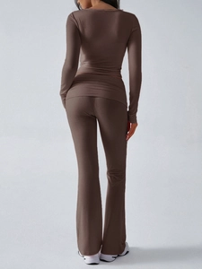 Detail view of the slim-fit brown knitted long sleeve top and flare pants from behind