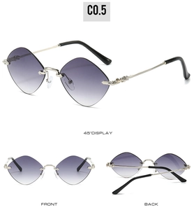 Detailed macro view of vintage carved metal temples on purple rimless diamond sunglasses