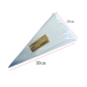Macro shot of 16x30cm clear cone bags with gold twist ties for wedding candy packaging