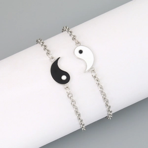 Detail of Yin Yang Tai Chi pendant bracelets with silver-tone stainless steel chains