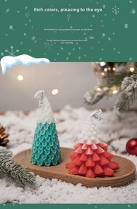 Macro detail of Christmas tree scented candles with realistic leaf textures on wood
