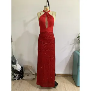 Detail view of red sequin evening dress with halter neck and cutout bodice