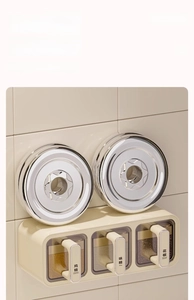 Detail of wall-mounted kitchen spice box showing three drawers and heavy weight capacity
