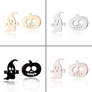 Macro shot of Halloween ghost and pumpkin studs in gold, silver, black, and rose gold