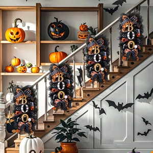 Set of four Halloween BOO wreaths with black mesh and orange polka dot ribbons on stairs