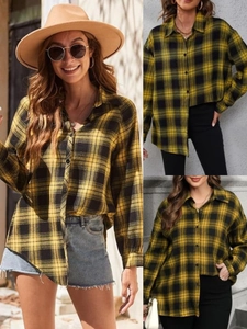 Classic yellow and black plaid long sleeve button-down shirt for women in outdoor setting