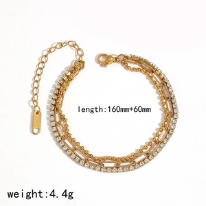 Detail of 160mm+60mm gold stainless steel layered chain bracelet with sparkling rhinestones