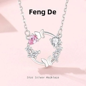Detail of S925 silver necklace with pink zircon butterfly and wreath pendant design