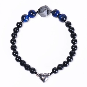 Detail of 6mm black beads bracelet with blue tiger eye stones and heart magnetic clasp