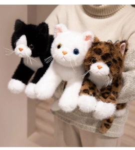 Detailed realistic plush cat dolls with vivid whiskers and glass eyes held by hand