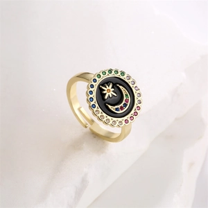 Detail of adjustable star moon ring with black enamel and colorful cubic zirconia