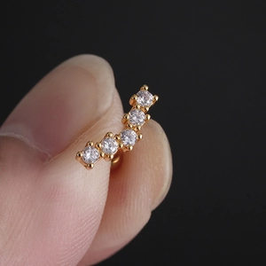 Curved stainless steel helix earring with five sparkling cubic zirconia in gold plating