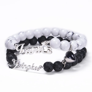 Detail of magnetic heart clasp on white turquoise and lava stone couple bracelets