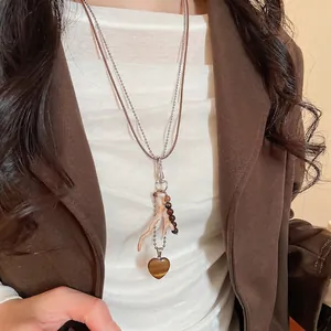 Bohemian double-layered necklace with tiger eye heart pendant and coral branch accents