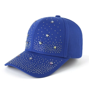 Side view of dark blue baseball cap with gold rivets and star-shaped colorful rhinestones