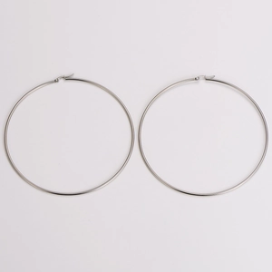 Detail of 100mm oversized stainless steel hoop earrings with polished silver finish