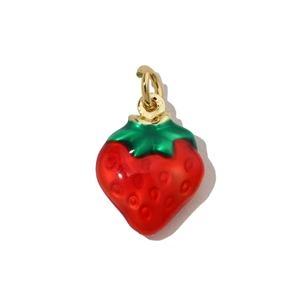 Close-up of a red strawberry pendant charm with a gold loop for DIY jewelry making