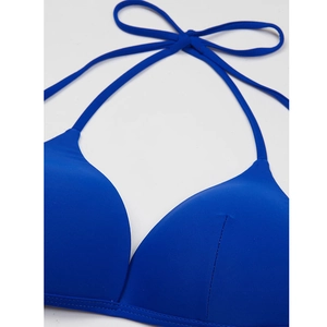 Close-up of royal blue halter bikini top featuring precise stitching and stretch fabric