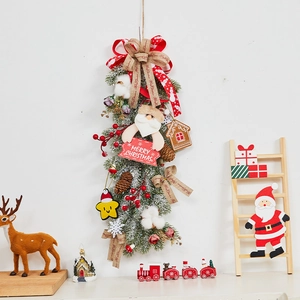 Christmas rattan wreath decoration with Santa doll, red ribbon bow and pine needles