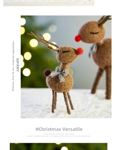 Detailed view of a brown wool felt reindeer ornament with red nose and gray bow detail