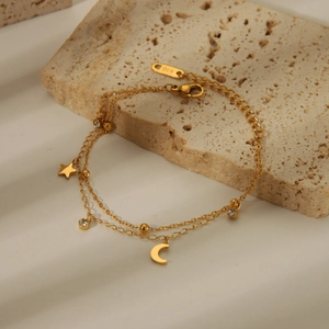 Double-layered 18K gold plated titanium bracelet with star, moon, and clover charms