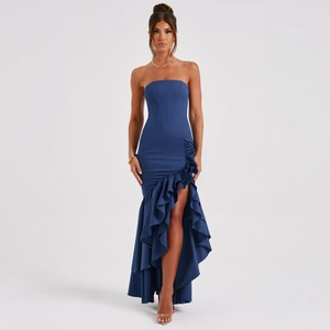Detail of dark blue strapless mermaid dress with ruffled asymmetric hem and high slit