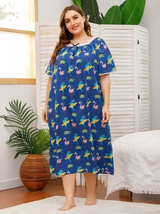 Detail of plus size sleepwear with flamingo print and delicate white lace trim on neckline