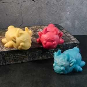 Three cute little monster art ornaments on vintage books with creative industrial design