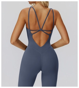 Detail of cross-back straps on deep V-neck yoga bodysuit with moisture-wicking fabric