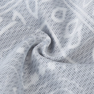 Macro shot of breathable white mesh fabric with grey digital paisley print details